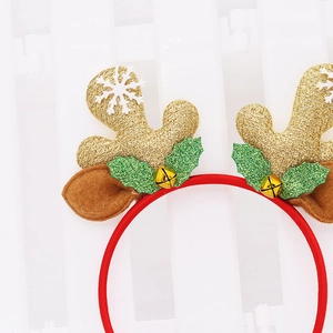 Close-up of Christmas headband featuring glittery golden antlers and red bell details