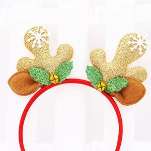 Detailed view of Christmas headband with gold glitter antlers, bells, and holly leaves