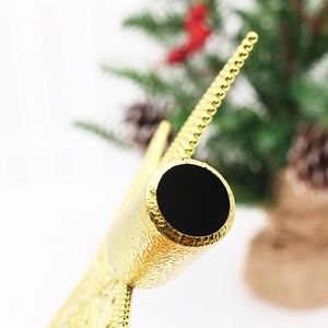 Macro shot of gold star tree topper metal base with textured finish for Christmas tree