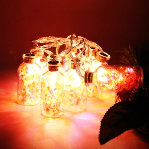 LED glass bottle string lights with colorful stones and warm glowing copper wire bulbs