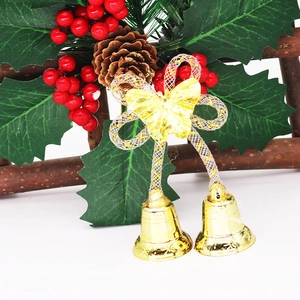 Christmas wreath bells with red berries pine cones and green holly leaves decoration