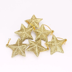 Close-up of 6 pieces golden glitter star ornaments for Christmas tree decoration