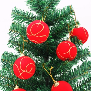 5cm red Christmas balls with gold glitter patterns hanging on green pine branches