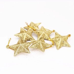 Set of six shimmering gold glitter star ornaments for Christmas tree decoration