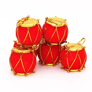 Five red flocked Christmas drum ornaments with gold strings for tree decorations