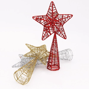 Detail of red, gold and silver glittered wire star tree toppers for Christmas trees