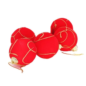 Red flocking Christmas balls with gold glitter swirls for festive tree decoration