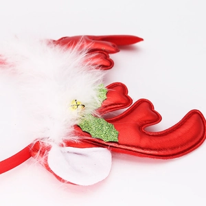 Christmas reindeer antler headband with festive red fabric and white faux feathers