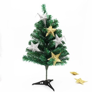 Mini sapin de Noël de table avec étoiles scintillantes or et argent sur un support trépied