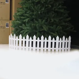 Close-up of white thick plastic garden fence panels for Christmas tree base decoration