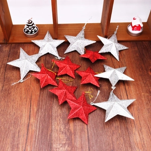 Detail of red and silver glitter star ornaments for Christmas trees with hanging cords