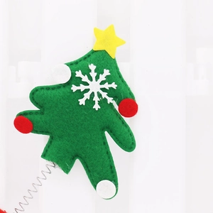 Detail of Christmas tree felt headband with small spring and white snowflake ornaments