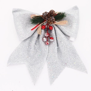 Nœud de Noël argenté à paillettes avec pommes de pin et baies pour décoration