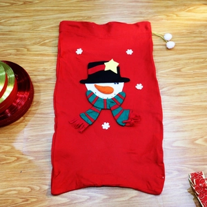 Detailed view of red Christmas gift bag featuring a 3D snowman and white pom-poms