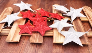 Close-up of sparkling red and silver 5cm Christmas star ornaments with glitter finish