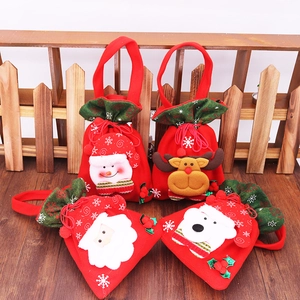 Close-up of plush Christmas candy bags featuring 3D Santa, snowman, reindeer and bear dolls