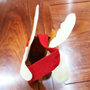 Top view of handmade felt Christmas gift bag showing the red handle and spacious opening