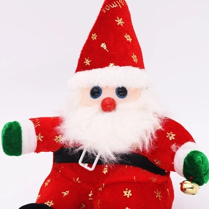 Detail of red plush Santa Claus with gold embroidery and a metal jingle bell