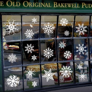 White snowflake window decals set for Christmas and winter glass shop decor