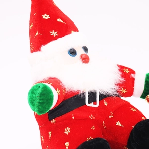 Close-up of Santa plush doll featuring gold snowflake patterns and a soft white beard