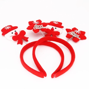 Detail of Christmas headbands featuring a cute snowman and Merry Christmas snowflake charms