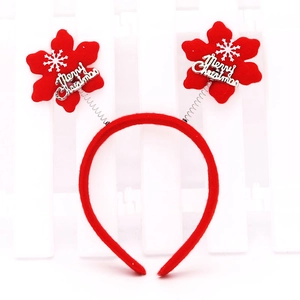 Red Christmas headband with spring-mounted Merry Christmas stars and snowflake patterns