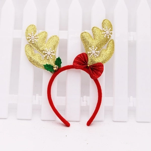 Glittery gold reindeer antler headband with red bow and snowflakes for Christmas party