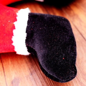 Funny inverted Santa Claus legs decoration with red velvet pants and black boots