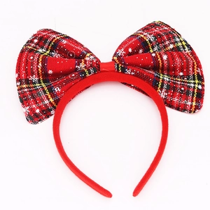 Christmas red plaid oversized bow headband with white snowflake prints on a white background