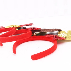 Sparkly reindeer antler headband set with red bows and gold bells for Christmas party