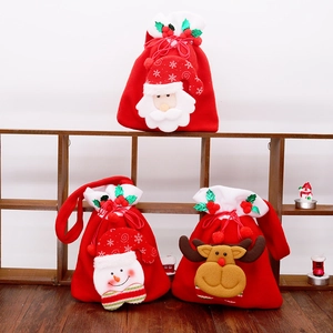 Detail of red plush Christmas drawstring gift bags with 3D Santa, snowman and elk designs