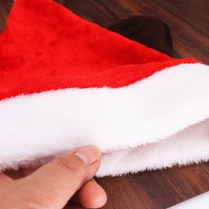 Detailed close-up of plush white brim texture on a thick red festive Christmas hat