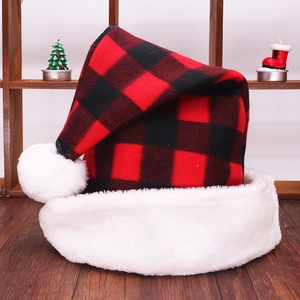 Detailed view of red and black buffalo plaid Christmas hat with white faux fur trim