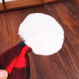 Classic red and black buffalo plaid Christmas hat with a fluffy white faux fur pompom ball