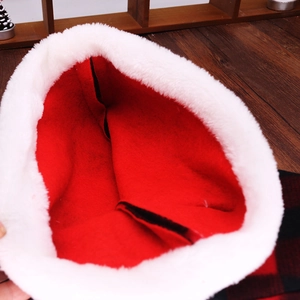 Detail of red flannel fabric and thick white faux fur lining on a Christmas hat