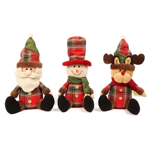 Three sitting Christmas plush dolls with Santa, Snowman and Reindeer in plaid fabric