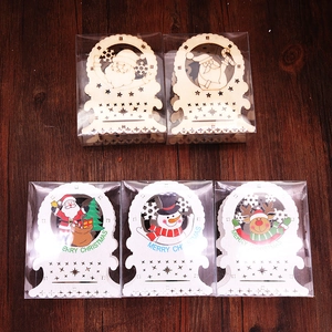 Detail showing 5-piece wooden Christmas ornaments with LED lights in clear packaging