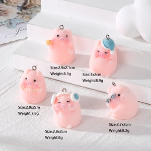Five cute pink flocked pig figurines wearing headphones and hats for DIY jewelry crafts