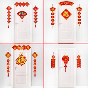 Detail view of red and gold Chinese New Year door decoration sets with fu character