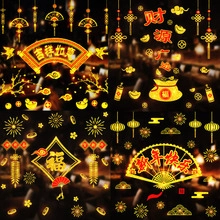 Detail view of Lunar New Year window stickers with traditional red and gold festive patterns