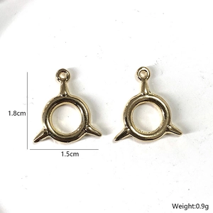Golden alloy punk circle pendants with three spikes and dimensions of 1.8cm by 1.5cm