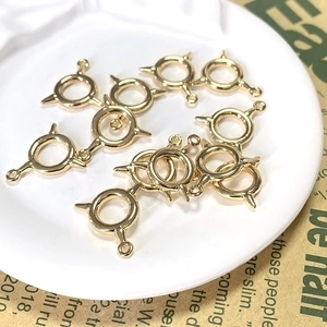 Golden geometric alloy circle charms with triple spike detail for DIY jewelry making