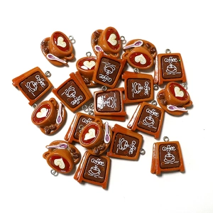 Detailed view of resin coffee cup and shop sign charms for DIY jewelry and keychains