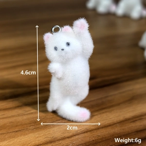 Detailed size view of a white flocked cat pendant with 4.6cm height and metal loop