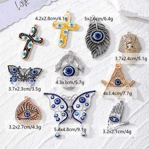 Set di ciondoli malocchio in lega con hamsa e farfalla per la creazione di gioielli fai da te