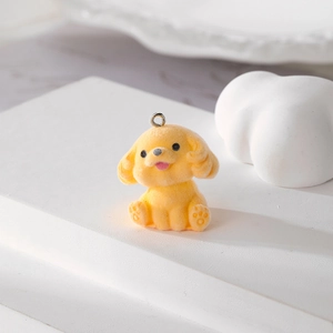 Detail of yellow flocked puppy pendant with soft texture and metal ring for DIY jewelry