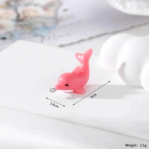 Pink resin dolphin pendant for DIY jewelry showing 3cm length and silver ring detail