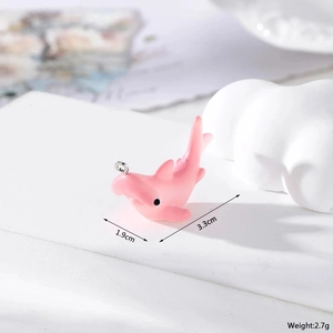 Pink resin dolphin pendant for DIY jewelry showing 3.3cm by 1.9cm dimensions and 2.7g weight