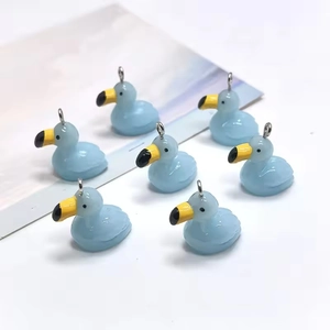 Set of seven light blue resin duck pendants for DIY jewelry and keychain accessories