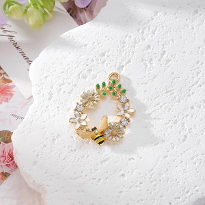 Water-drop floral wreath pendant with honey bee, enamel flowers and sparkling rhinestones